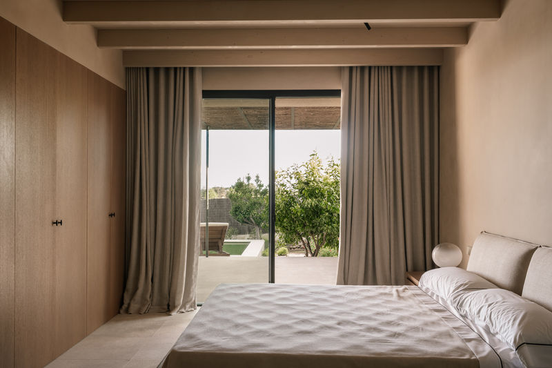 Bedroom with natural oak floor and calm palette