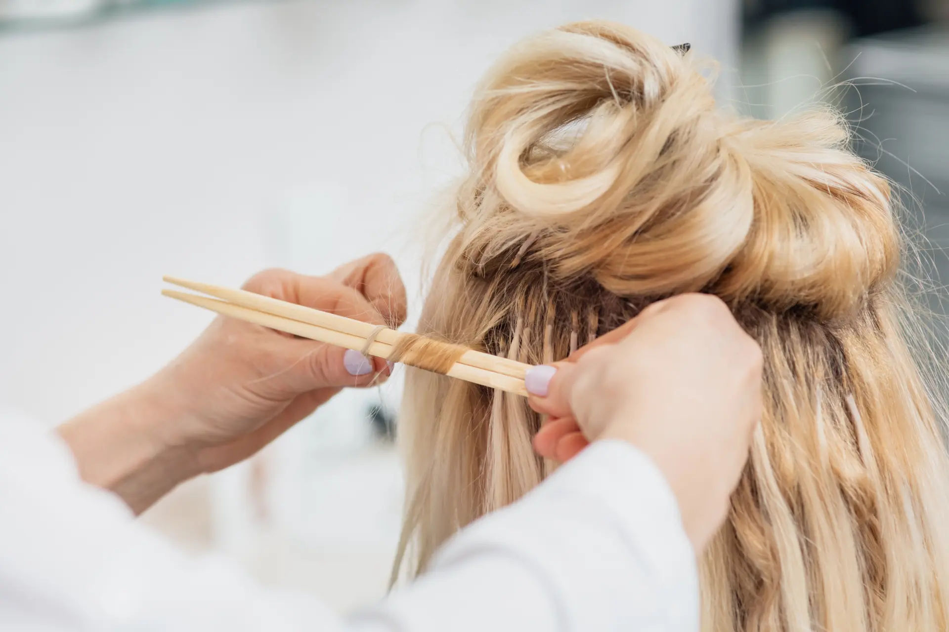 Model showcasing long Russian Genius Weft hair extensions