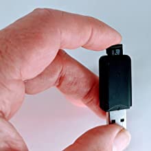 Insert into your sim card reader. Plug into an available usb slot on your PC