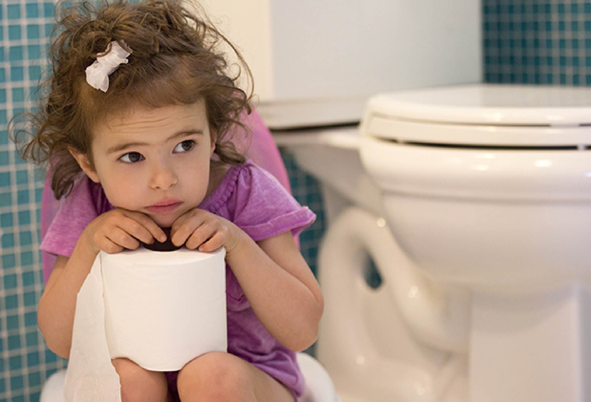 A Constipated Young Girl Using A Potty by Ron Sutherland/science
