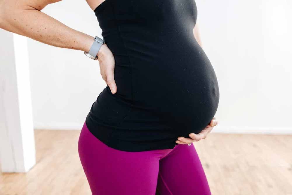 Coping with pregnancy-related back pain: Posture correction and gentle stretching