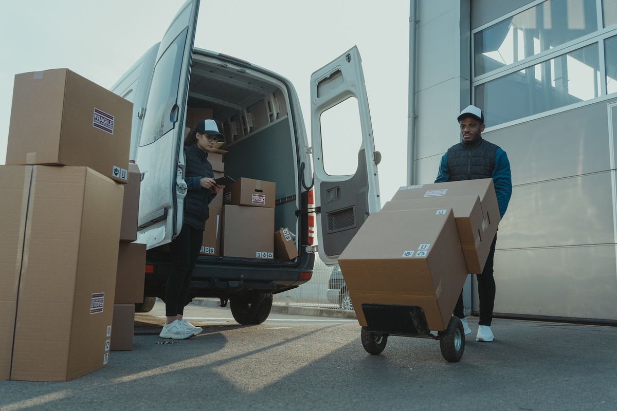 Man and woman unloading moving van 