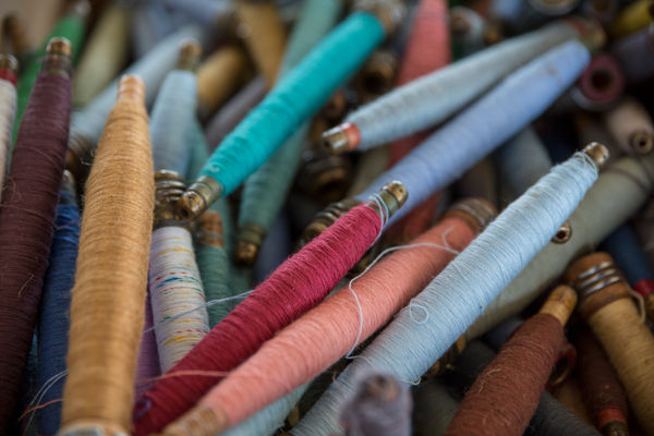 Bucket of Thread Spools 