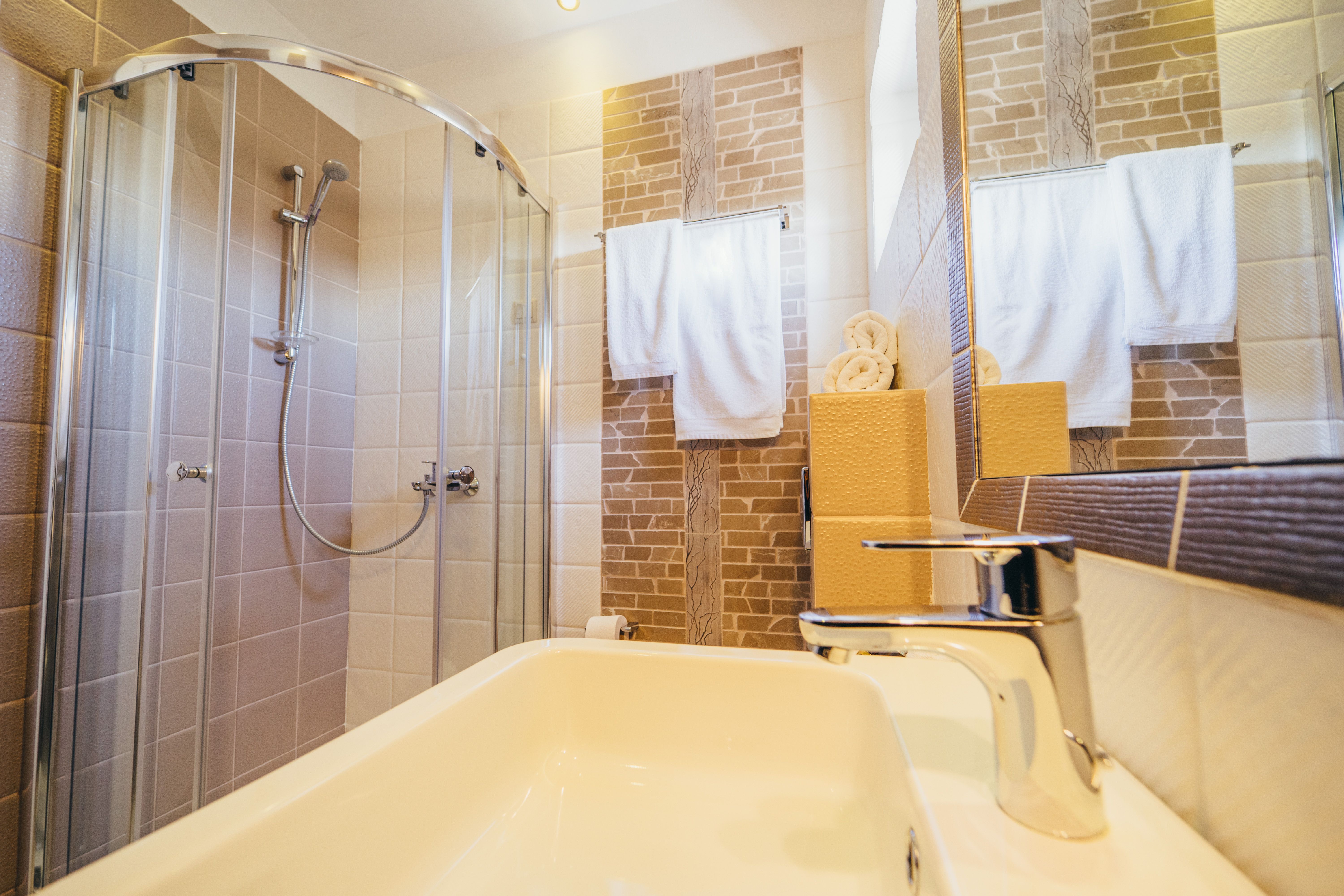 Private bathroom with shower and sink in standard room