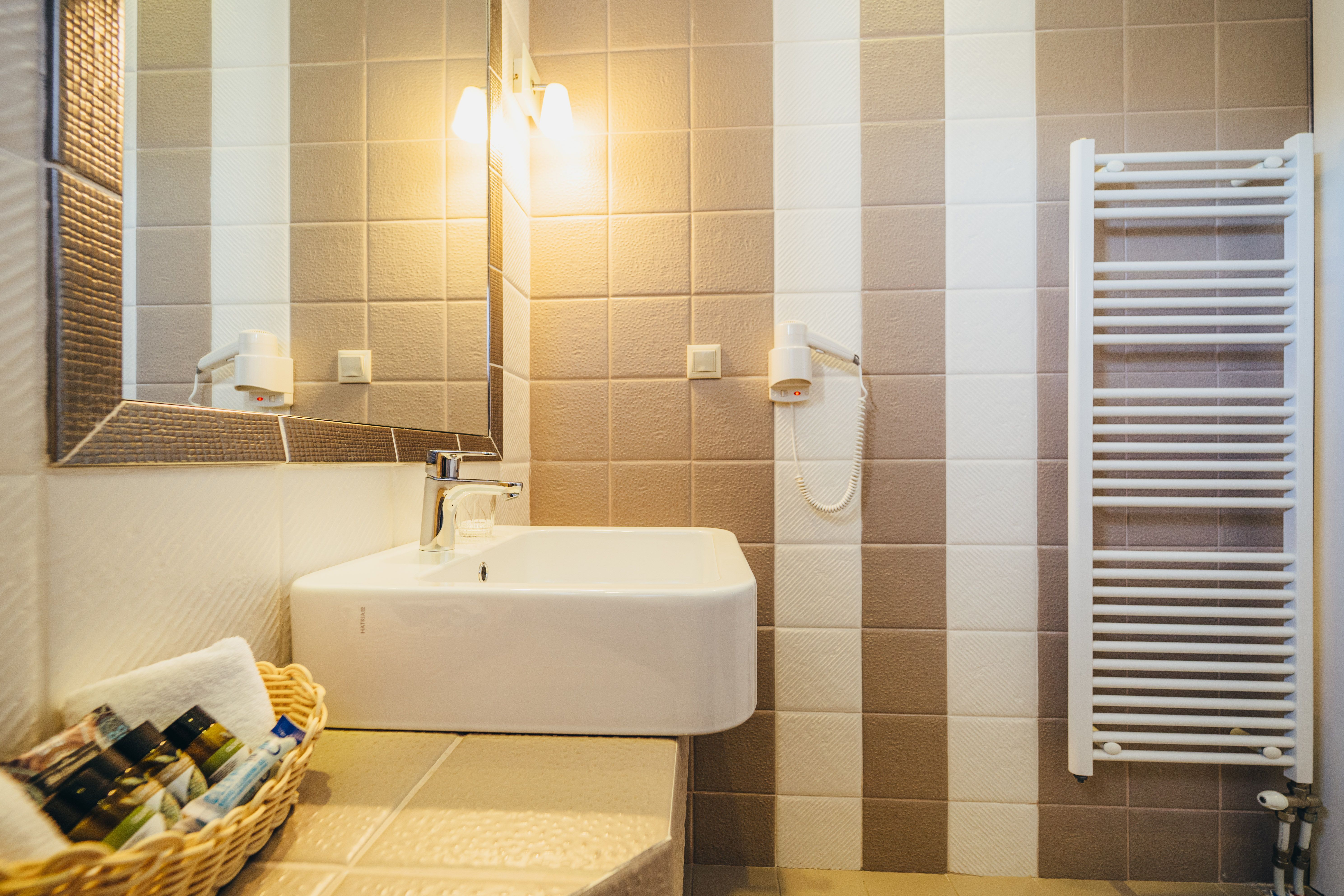 Bathroom sink with mirror in standard room