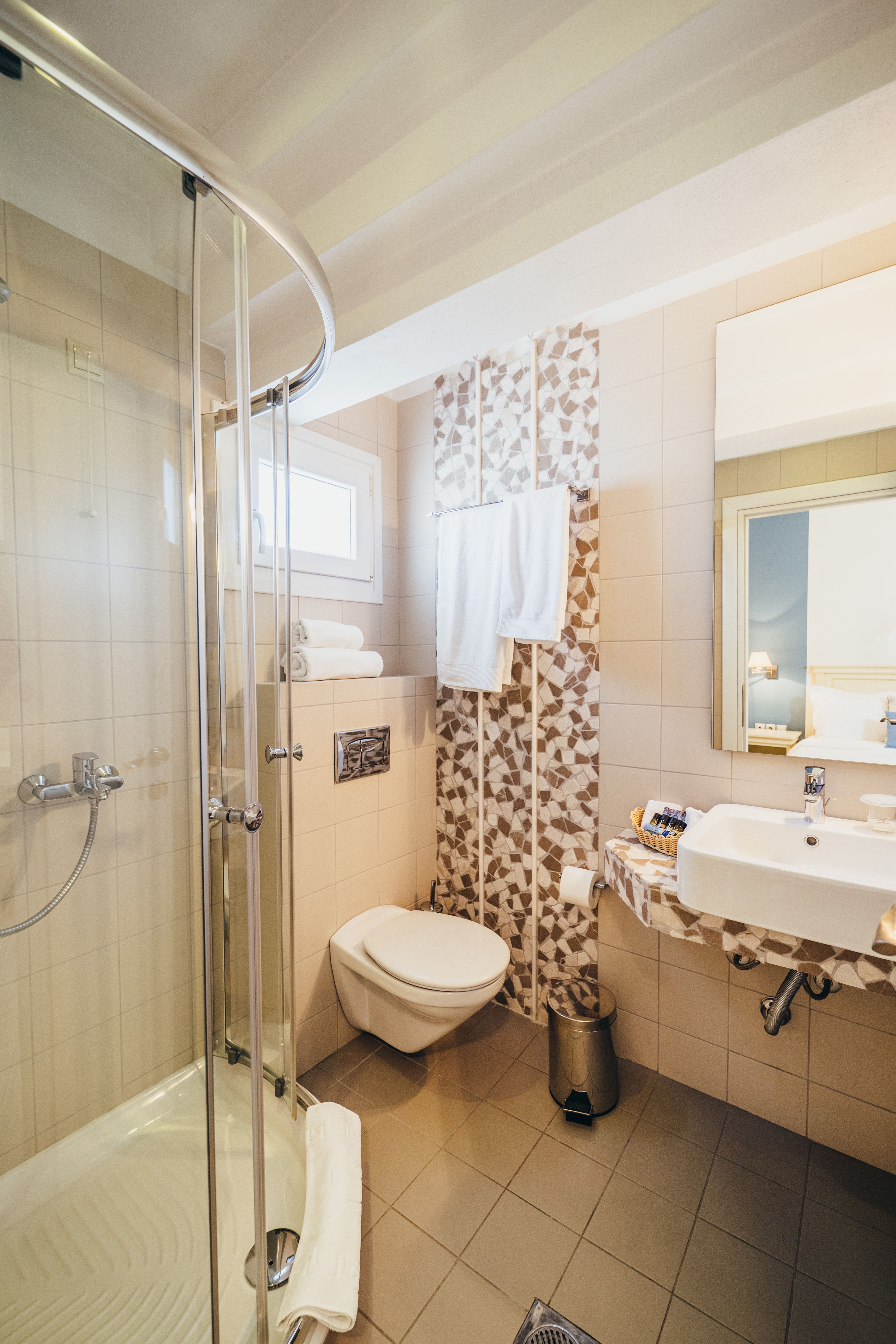 Bathroom interior with shower cabin in budget room