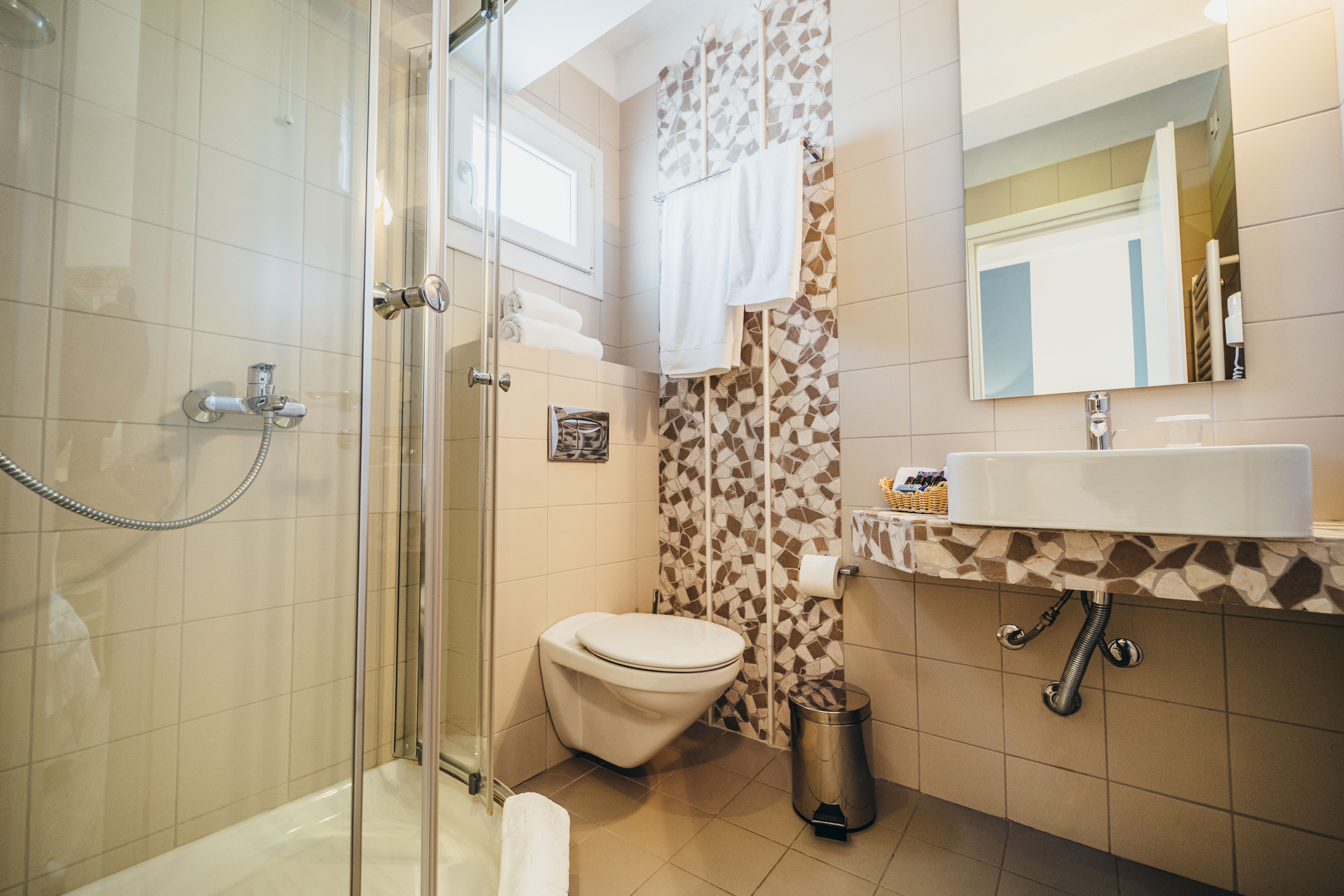 Private bathroom with shower and toilet in budget room