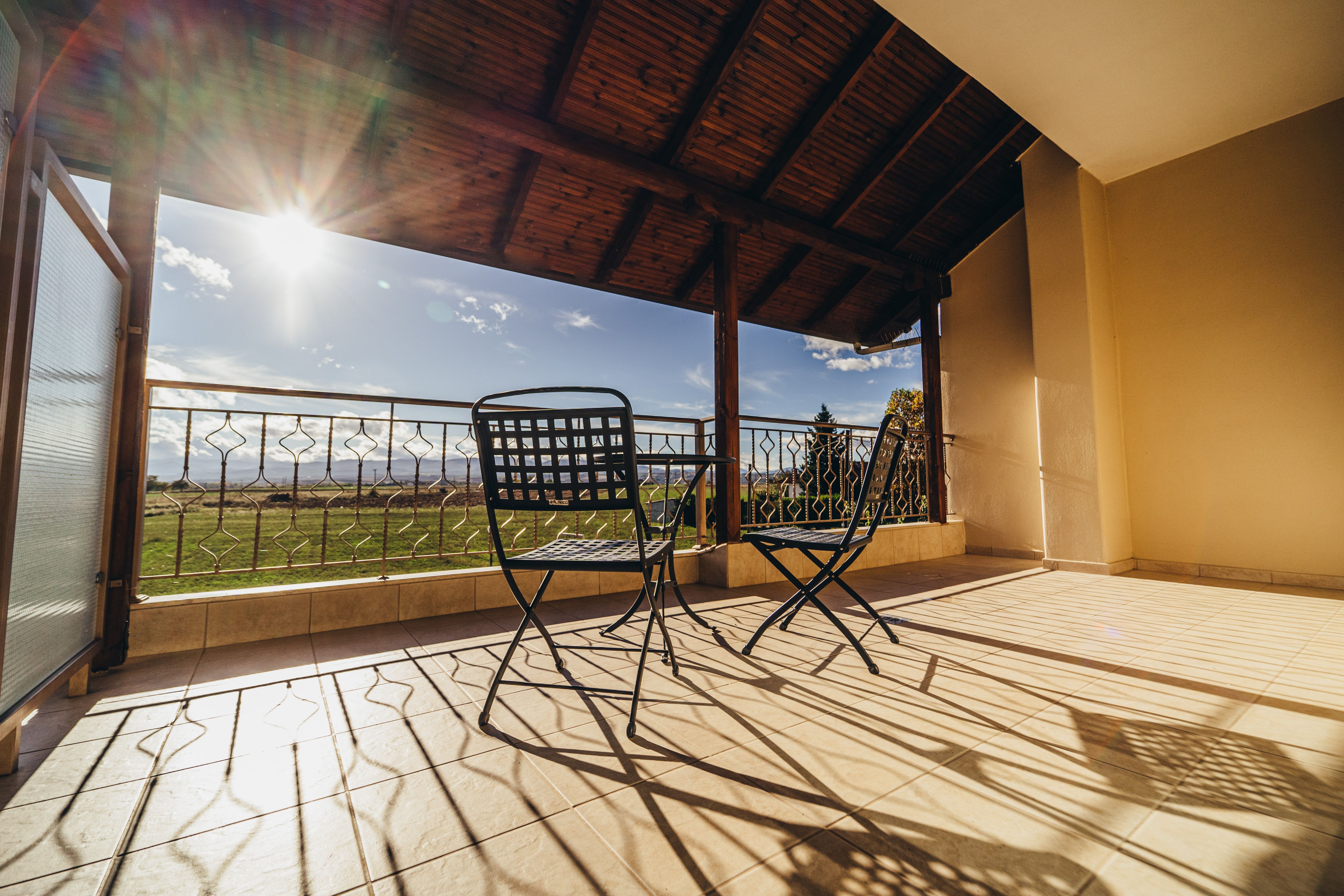 Balcony with outdoor seating and view from deluxe green room