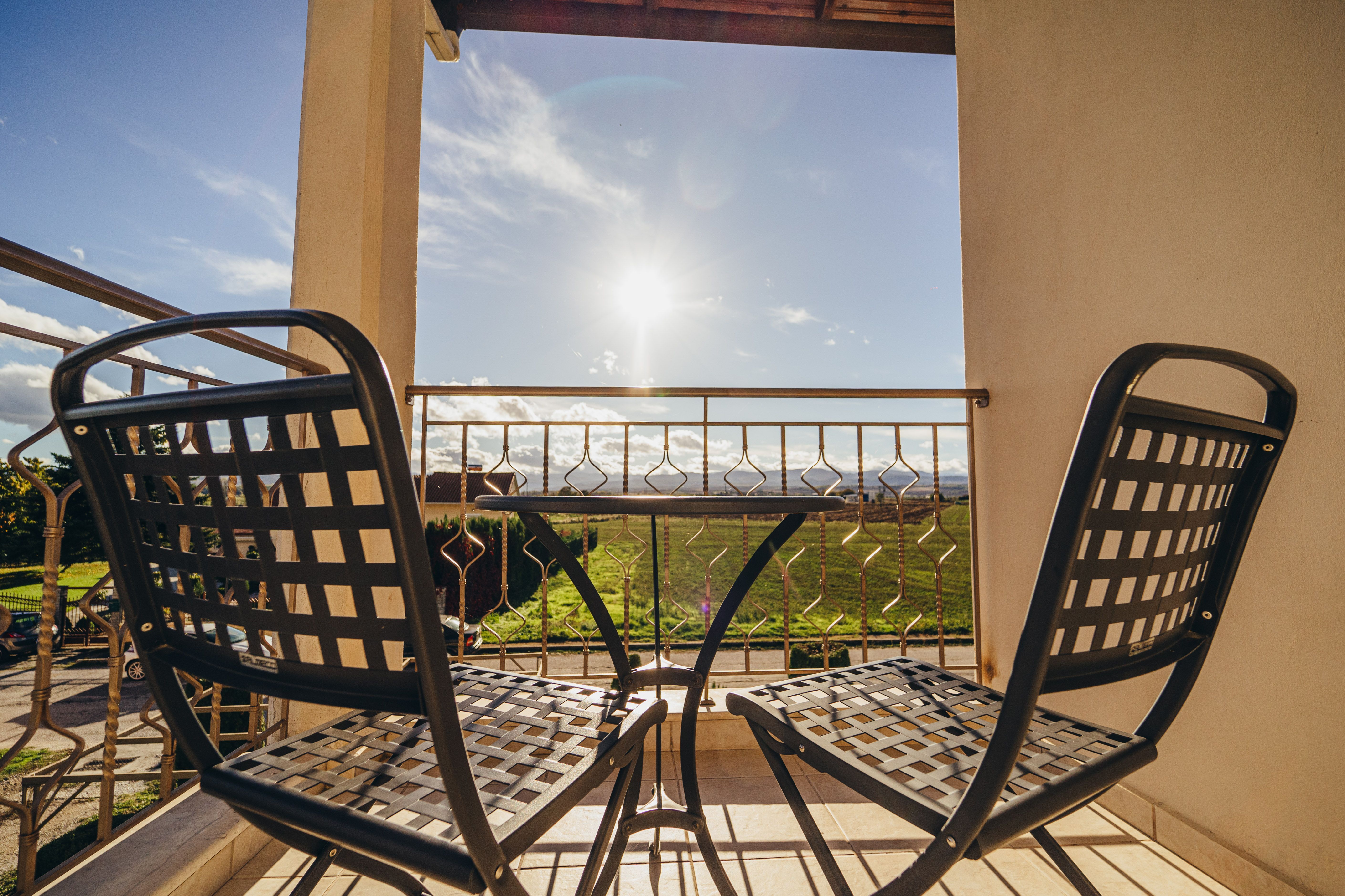 Balcony with outdoor seating and view from standard room