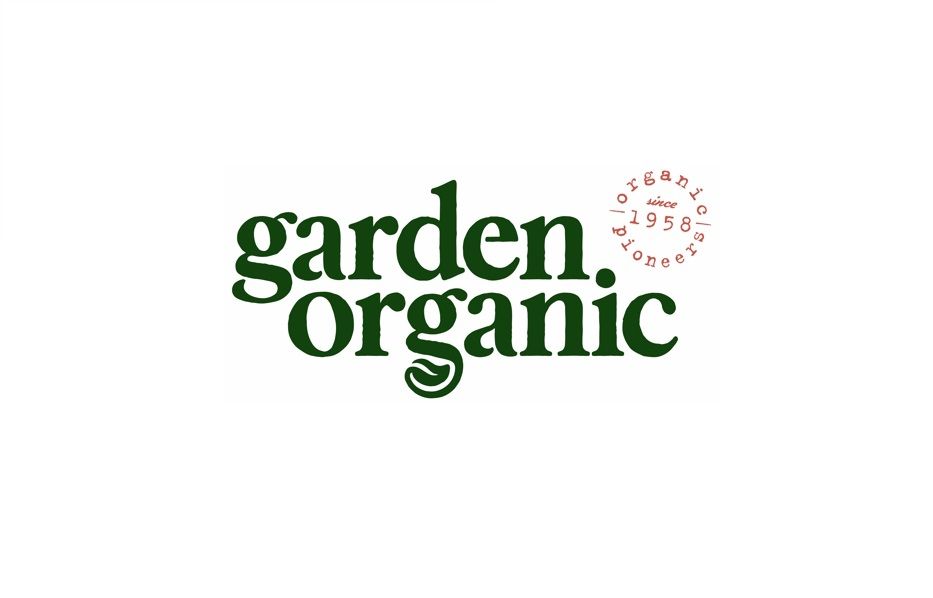 A logo with the text garden organic in green font