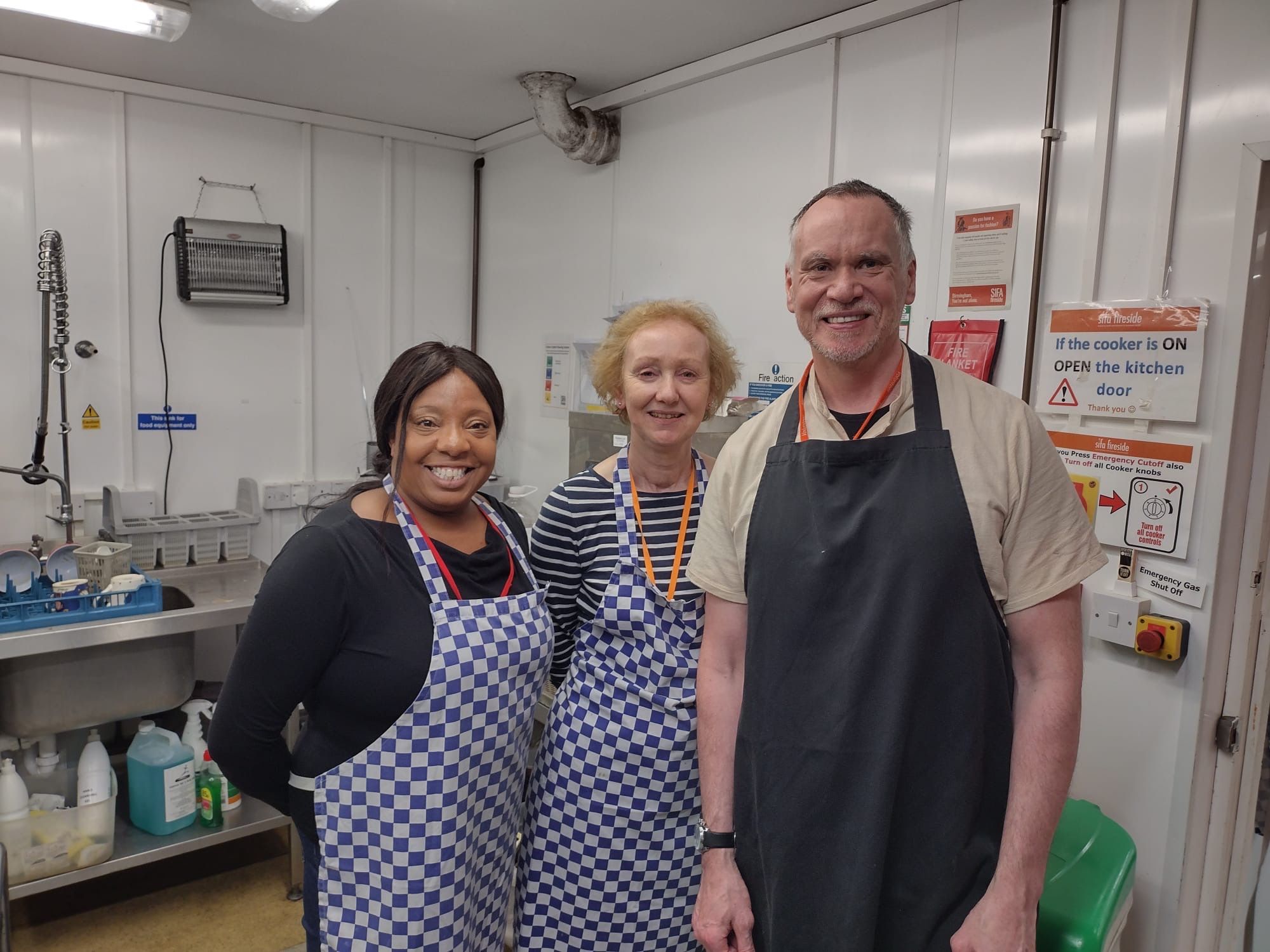Individuals volunteering at a charity in Birmingham