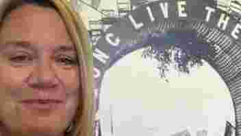 Volunteer standing in front of museum