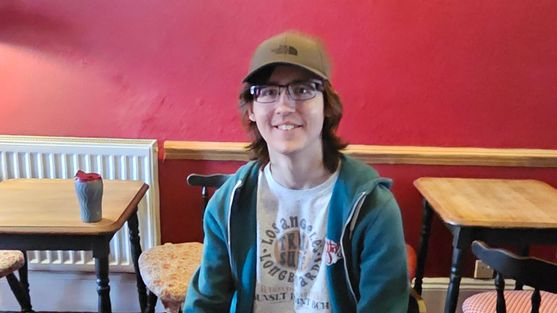 Photograph of Harry smiling at the camera