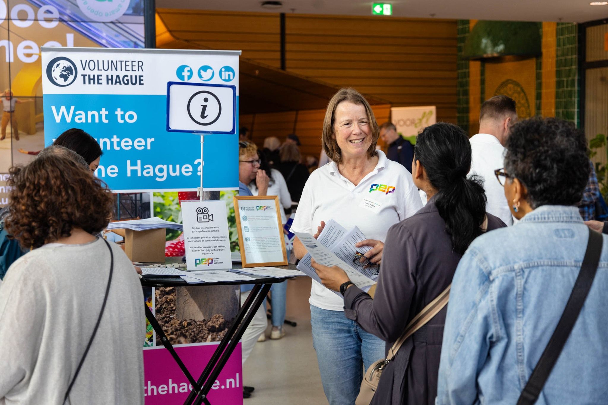 Mark your calendars for Saturday, May 10th, 2025, we're hosting this year's supersized version of the Mix & Match Volunteer Job Fair titled "Together at Home" at the beautiful Amare in The Hague!    After the great turnout at our last supersized event in May of last year, the Volunteer The Hague team is hard at work planning our next fun and informative event! This isn't just another volunteer job fair, it's a chance to connect with the heart of our community. The "Together at Home" fair is designed to bring together diverse organizations from across The Hague, all eager to welcome passionate volunteers like you. Whether your interests lie in working with children, supporting the elderly, protecting our environment, or contributing to local initiatives, you'll find something that sparks your passion.    This event is organized by the Volunteer The Hague project of PEP Den Haag in collaboration with the Residentie Orkest, Open Amare, Cultuurschakel, and the Municipality of The Hague.        And just as last year, this Volunteer Market will be filled with beautiful sounds from the Residentie Orkest, followed by a series of performances by local music groups where each performance will reflect the cultural diversity of The Hague.         Think of it as a dynamic marketplace of volunteer opportunities. You'll have the chance to chat directly with representatives from various organizations, learn about their missions, and discover how your skills and time can make a real impact. It's the perfect way to explore different roles and find a volunteer experience that truly resonates with you.    At Volunteer The Hague, we believe in the power of community and the importance of active citizenship. PEP Den Haag, our parent organization, works tirelessly to strengthen communities and promote volunteering throughout the city. This volunteer job fair is a testament to that commitment, connecting individuals with meaningful opportunities to contribute.        We understand that finding the right volunteer role can sometimes feel overwhelming. That's why we've created the "Together at Home" fair – to simplify the process and make it fun! It's a chance to meet like-minded individuals, discover new passions, and contribute to making The Hague an even better place to live.    So, save the date - May 10th, 2025, at Amare in The Hague and get ready to find your perfect volunteer match at the "Together at Home" Volunteer Job Fair. We're incredibly excited to welcome you!        As we get closer to the event, we'll be sharing more details about participating organizations and the event schedule. Stay tuned for updates by following Volunteer The Hague on Instagram, Facebook, and LinkedIn. We encourage you to spread the word and invite your friends and family. Let's come together and make a difference!    We at Volunteer The Hague and PEP Den Haag look forward to seeing you there!