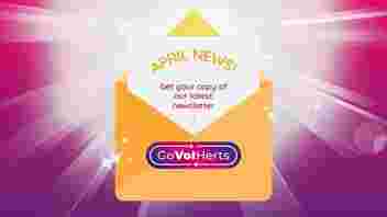 April Newsletter Yellow Envelope opened against a starburst background