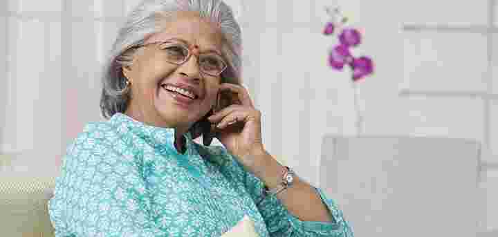 lady smiling whilst on the telephone lady smiling whilst on the telephone