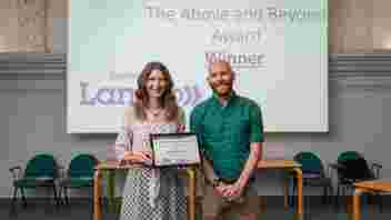 image is of 2023 award winners holding their framed certificate