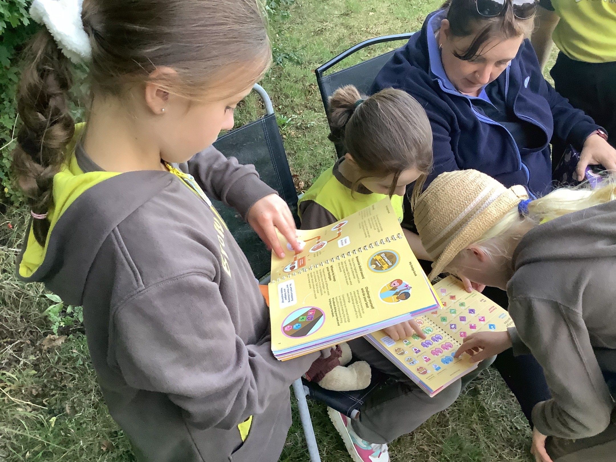 Unit Leader, helper, youth worker helping with activities for girls