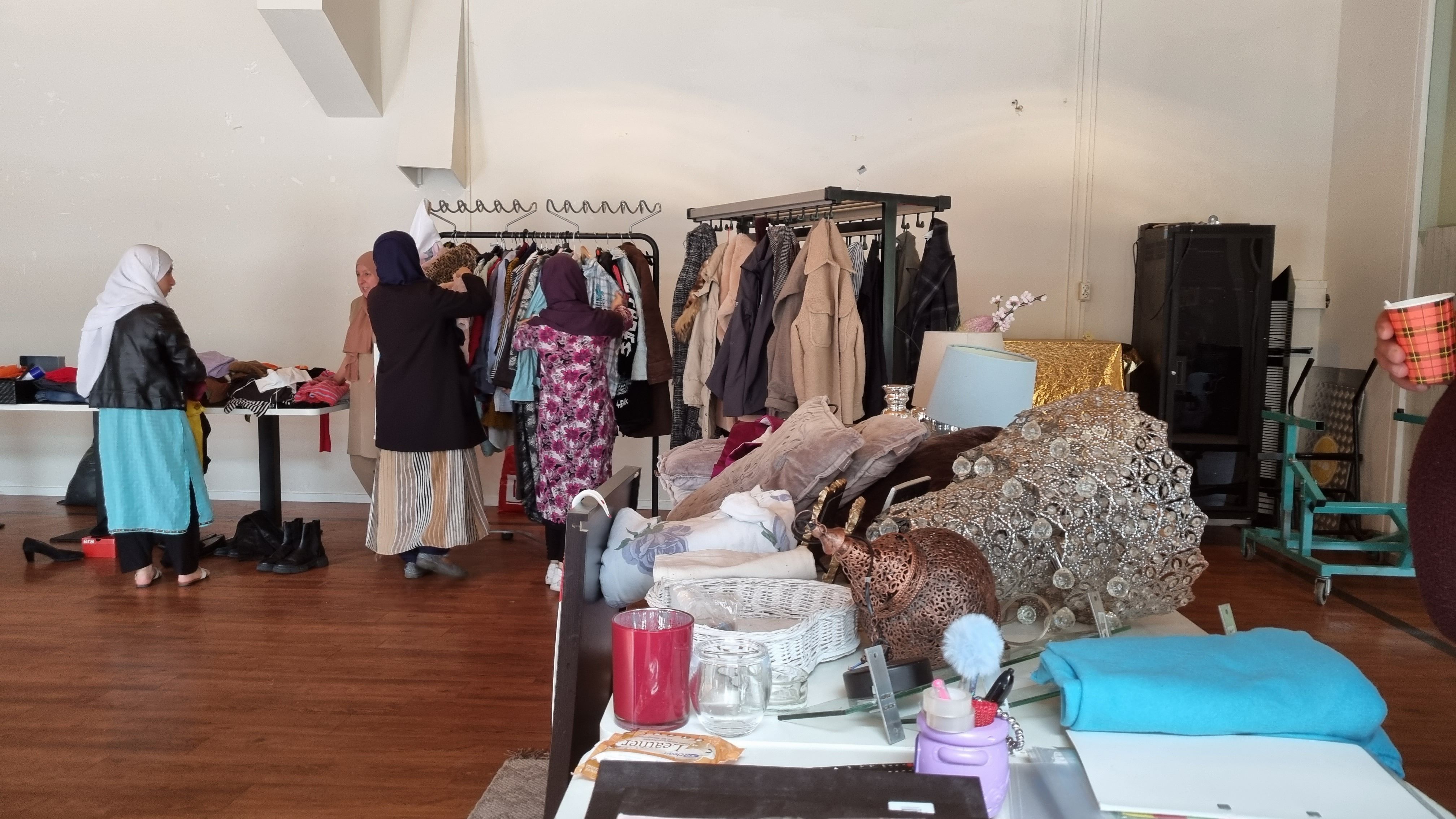 Layout of a giveaway shop: racks, cupboards, sofa, etc