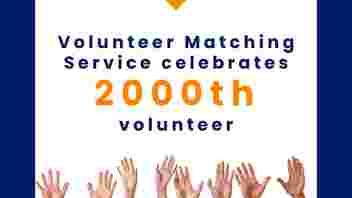 Image with a row of hands reaching up into the air with wording: Volunteer Matching Service celebrates 2000th volunteer