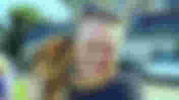 Alex holding a puppy