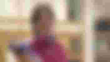 Photograph of Kate packing bags of food.