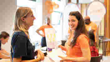 The May 2023 edition of the Mix & Match Volunteer Job Fair has come to a close, leaving attendees and The Hague non-profits with lasting memories and a sense of fulfillment. In this post-event article, we take a moment to reflect on the highlights and key takeaways from this remarkable event. Held on May 13 at The Social Hub, the Volunteer Job Fair was not merely a one-day event, but a beginning of a meaningful journey for many local NGOs and international volunteers. This edition of the Mix & Match event was a resounding success, drawing more than 300 attendees eager to explore volunteer opportunities in the city and engage with like-minded individuals. The sheer number of attendees highlighted the growing interest and commitment to volunteerism within the international community of The Hague. Moreover, the fair played host to an impressive lineup of nearly 30 organizations, each dedicated to diverse causes and eager to connect with individuals willing to contribute their time, skills, and compassion. MCed by our project manager Tetyana Benzeroual, the fair began with an opening ceremony where Gert-Jan Aleman, the director of PEP Den Haag (parent organization of Volunteer The Hague) welcomed attendees in his address while passing the floor to the Deputy Mayor of The Hague, Kavita Parbhudayal who highlighted the importance of volunteer work in the community. The Deputy Mayor commended Volunteer The Hague for its efforts in bringing together volunteers and non-profit organizations and urged the public to participate in volunteering activities. In her opening remarks, she reiterated the importance of internationals volunteering in our community. ‘Volunteering is the cement of our society. It connects people and builds bridges between internationals and non-internationals, which makes The Hague stronger’. Kavita Parbhudayal In the picture, from left to right, are: Gert-Jan Aleman, Kavita Parbhudayal, Tetyana Benzeroual The carefully curated event program featured a series of presentations delivered by esteemed professionals in their respective fields: Sarah Feid Account manager at The Hague International Centre talked about Job Hunting Strategies in The Hague Region, Abderrahim Kajouane Senior Advisor at PEP Den Haag shared the insides to The Hague as a Hub for NGO Professionals, Flora Bogman-Nieboer Senior Advisor at PEP Den Haag talked about Interviewing Skills for Volunteer Opportunities, Jobs, and More, and Tetyana Benzeroual Project Manager of Volunteer The Hague informed us How Volunteering Can Benefit Your Career. These presentations provided attendees with valuable insights, sence of belonging, and a deeper understanding of the benefits of volunteering. Throughout the day, attendees were not only inspired by these presentations but also engaged in conversations with representatives from participating organizations, further deepening their understanding of volunteer opportunities and building connections for future collaborations. All in all, the Mix & Match Volunteer Job Fair was a testament to the fact that voluntary work is not limited by age, occupation, or background. It was a beautiful tapestry of stories and journeys, where every thread wove together to create a brighter future. We extend our deepest gratitude to the organizations that shared their causes and opportunities, inspiring attendees to become active participants in mission-driven initiatives in The Hague. Through their commitment, the attendees left equipped with the connections and inspiration needed to make a long-lasting positive impact in their communities. Let us carry the spirit of volunteerism forward and keep building bridges between NGOs and volunteers in The Hague. Photos by Michel Heerkens For more photo impressions of the event please click here The Mix & Match Volunteer Job Fair through the eyes of attendees List of participating organizations 070online.nl - An organization offering local news and videos from The Hague region. ACCESS - A foundation that relies on its English-speaking international and Dutch volunteers who enjoy helping others adjust to life in the Netherlands. Community Plus - An organization focusing on closer social cohesion and a better quality of life in local neighborhoods in The Hague. Don Bosco Rijswijk - Multicultural youth center organizing activities for children and teenagers aimed at teaching play skills and allowing children to make friends. Expatriate Archive Centre - Historical organization that collects and preserves the life stories of expatriates worldwide for future research. Female Ventures - An organization that builds cross-generational community of ambitious female professionals. Haagse Watervrienden - The Hague Water Friends is a volunteer-run swimming association for young and old, which offers swimming lessons, competitive and master swimming, exercise for the elderly, and snorkeling activities in The Hague region. Justice & Peace Nederland - A human rights organization based in The Hague that provides temporary protection to human rights defenders and empowers citizens in the Netherlands to support refugees so that they may rebuild their lives. Leger des Heils - is is also known as the Dutch arm of The Salvation Army which helps vulnerable people in our society. Literaturhaus Deutsche Bibliothek - Aims to promote the cultural relationship between Germany and the Netherlands, in particular through German language and culture and the maintenance of a German-language library. Present Den Haag - A non-profit specialized in collaboration with all the professional welfare and mental healthcare organizations of The Hague and surrounding areas. RespijtHuis HouseMartin - A welcoming and warm temporary care home where homeless people in need can stay to recover from short-term illness. Romanian School the Hague - A foundation that provides informal courses in the Romanian language. Stadslink - An idealistic foundation that operates as a social enterprise, promoting people's economic and social independence. Stichting CENDDOW - The Centre for Diaspora Development Work is non-profit migrant organization that is focused on inclusive social cohesion for African migrants as part of our local society. Stichting CorrelAid Nederland - A non-profit network of data scientists who want to use their skills to advance the social good. Stichting Dessi Tuji - Non-profit organization for poverty alleviation and development cooperation in Ethiopia that provides children and adults with access to education and promoting the emancipation of Ethiopian women. Stichting TransitieCinema - An organization that runs documentary screenings on sustainability & transition, followed by Q&A sessions and workshops. Stichting Vitalis - Vitalis tries to prevent professional youth assistance for children between the ages of 5 and 18 who lack attention by linking these children to suitable buddies. TERRA Foundation - This organization promotes forest restoration and sustainable land management by providing financial and technical support to indigenous communities, helping to preserve biodiversity, wildlife, and ancestral knowledge. The Hague International Centre - A point of contact for internationals and international staff of organizations and companies in The Hague region. Together International - A non-profit dedicated to Development Aid and Humanitarian Aid projects. Under the Sun - A project that aims to empower vulnerable families in Western Sahrawi refugee camps by fundraising for house construction, as well as water tank and air conditioning installation. Viable Community - An international organization that enables people to preserve and restore nature while enjoying the experience. Wijkz - A welfare organization for the residents of The Hague, informing our community about activities, volunteer jobs, support in the neighborhood, and offering practical help where needed. Wool for Warmth - A non-profit dedicated to collecting wool and organizing knitting groups that knit clothing items for the homeless. Women's Initiatives Network - WIN is a non-profit dedicated to women, peace, and security for women in the Netherlands and Africa. YMCA Den Haag - The Hague chapter of the international youth organization that is committed to giving young people a place where they feel at home.