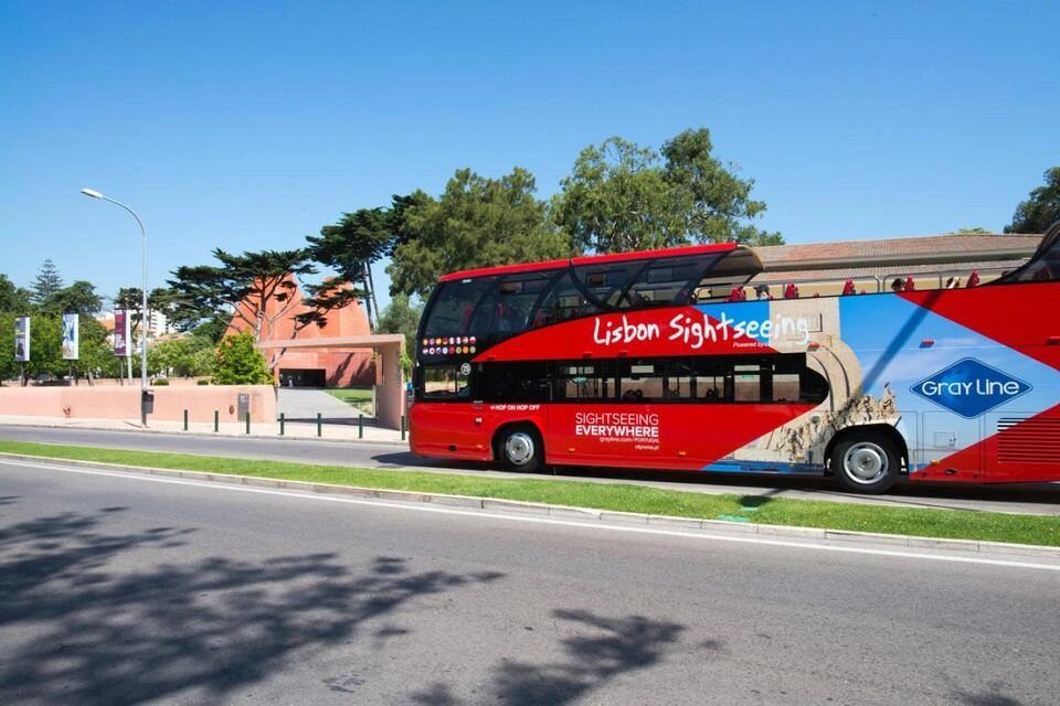 red and blue double-decker open-top sightseeing bus operated by Gray Line Portugal / Cityrama in Lisbon