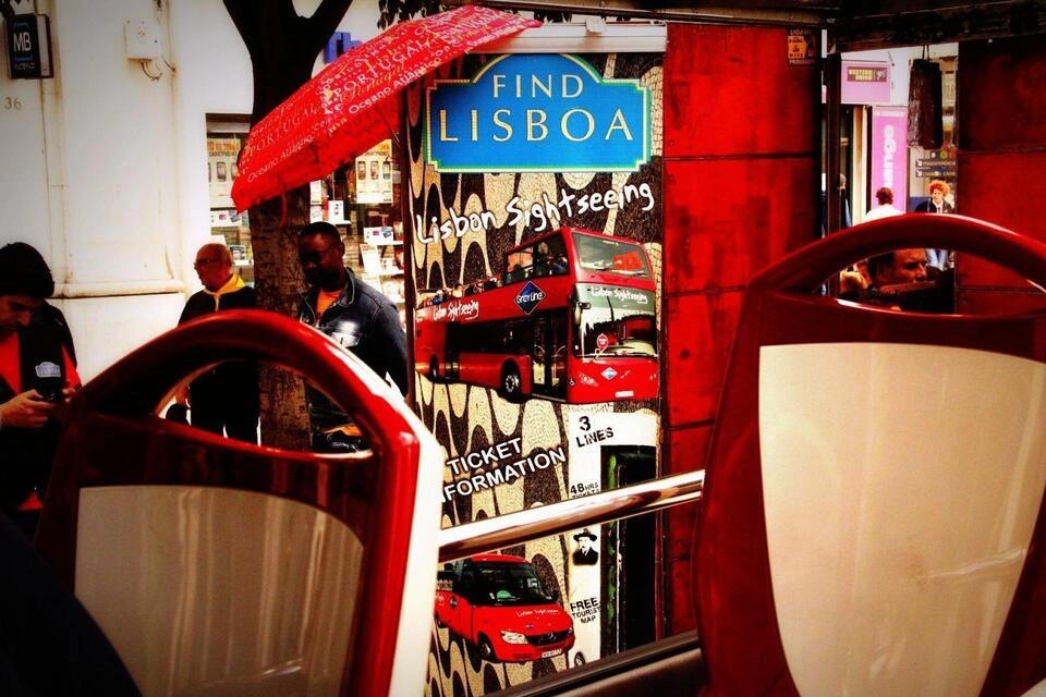  upper deck of a double-decker open-top sightseeing bus lisbon