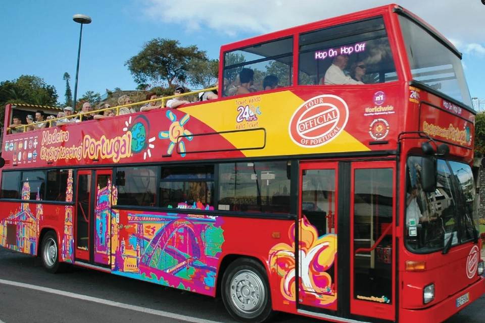 red double-decker open-top tour bus operated by City Sightseeing in Funchal