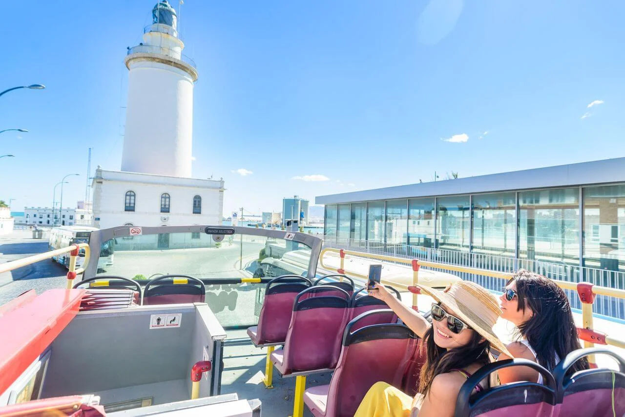  City Sightseeing Malaga Hop-On, Hop-Off Bus  the historic La Farola lighthouse in Malaga, Spain
