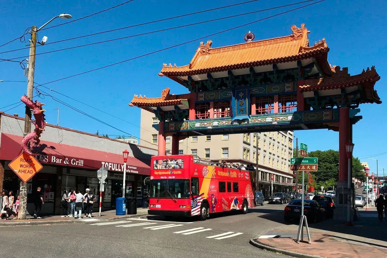 5th Avenue South in Seattle, Washington, featuring a City Sightseeing hop-on hop-off tour bus