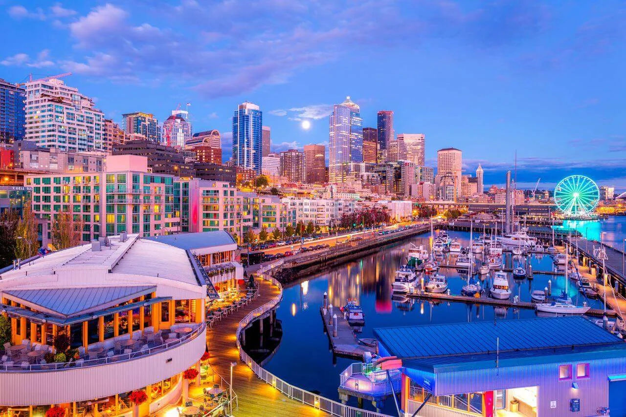 downtown Seattle waterfront from Pier 66, featuring the Bell Harbor Marina and the bright lights of the Seattle Great Wheel