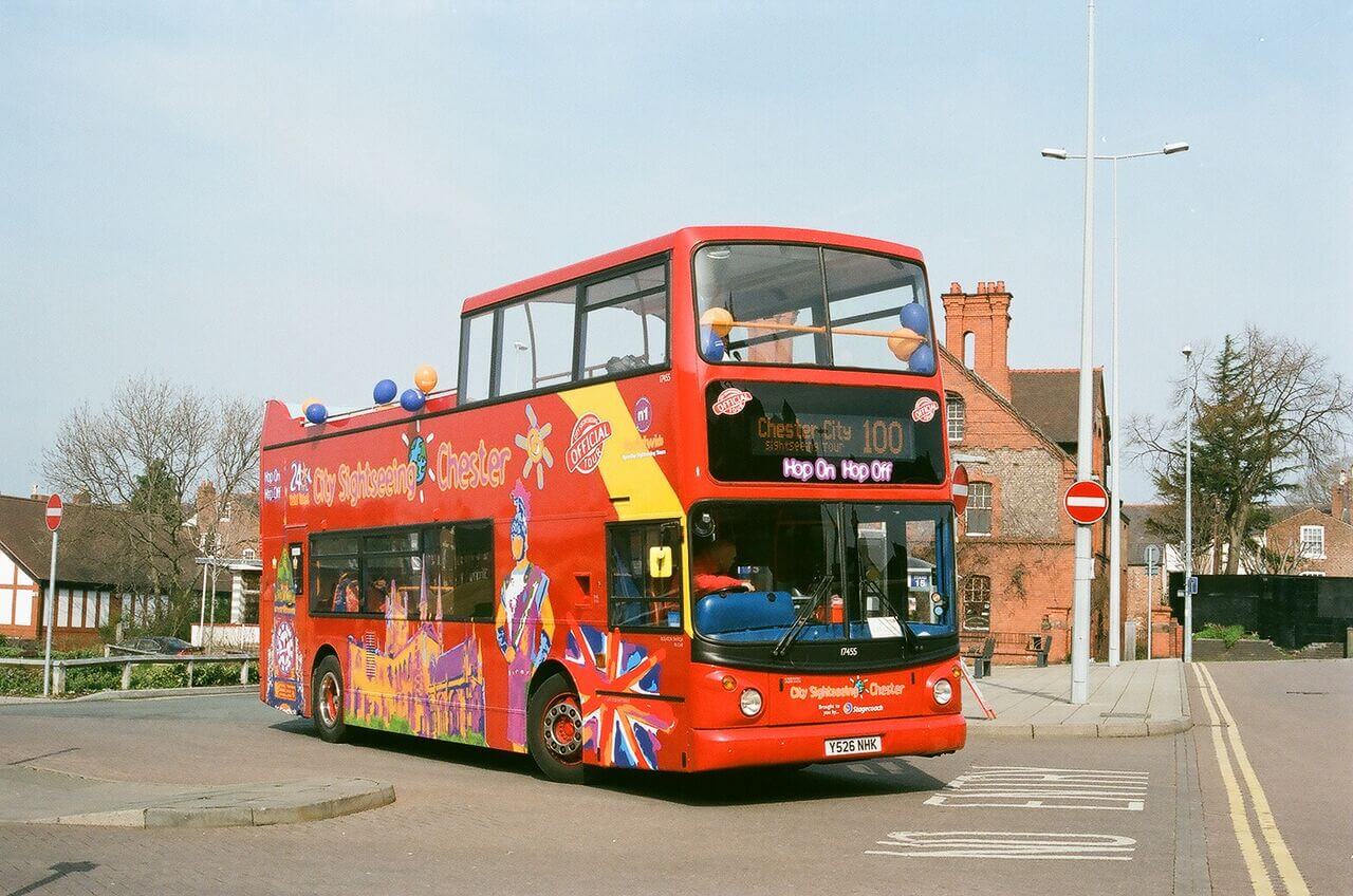 City Sightseeing hop-on hop-off tour bus operating in the historic city of Chester, England