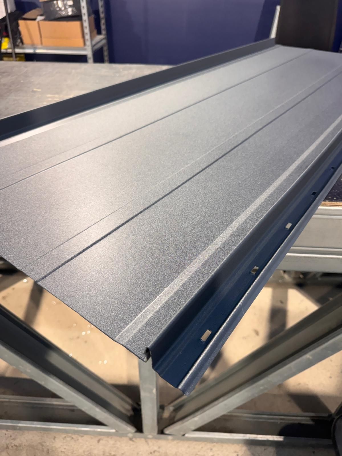 Close-up of classic profile roofing featuring a minimalist Nordic steel design.