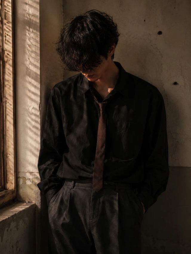 Moody Cinematic Portrait of a Lonely Young Man in Warm Window Light — ChatGPT prompt | pineprompts.com