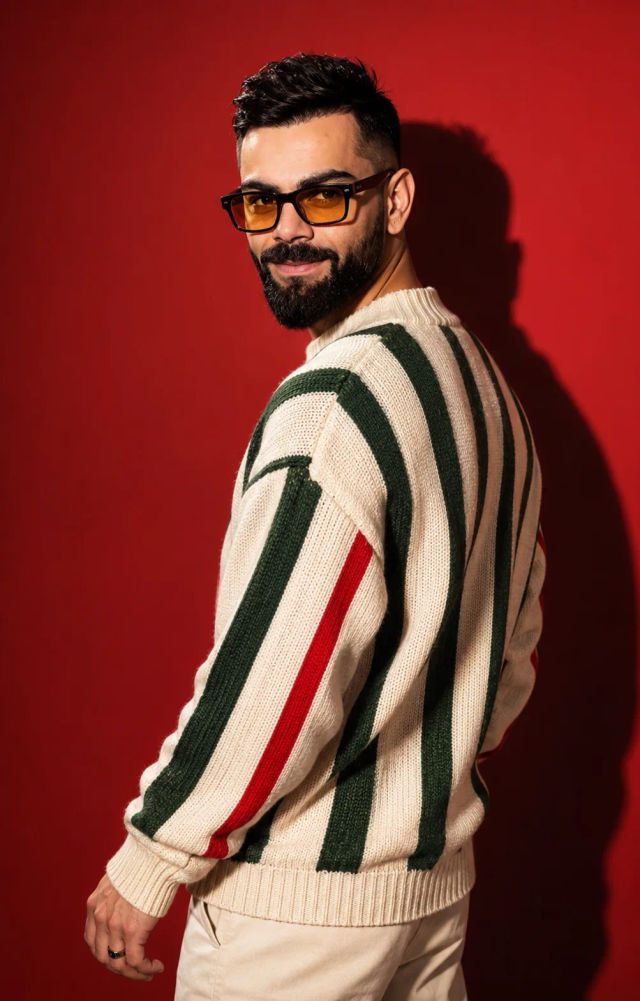 Stylish Studio Portrait in Oversized Striped Knit Sweater — ChatGPT prompt | pineprompts.com