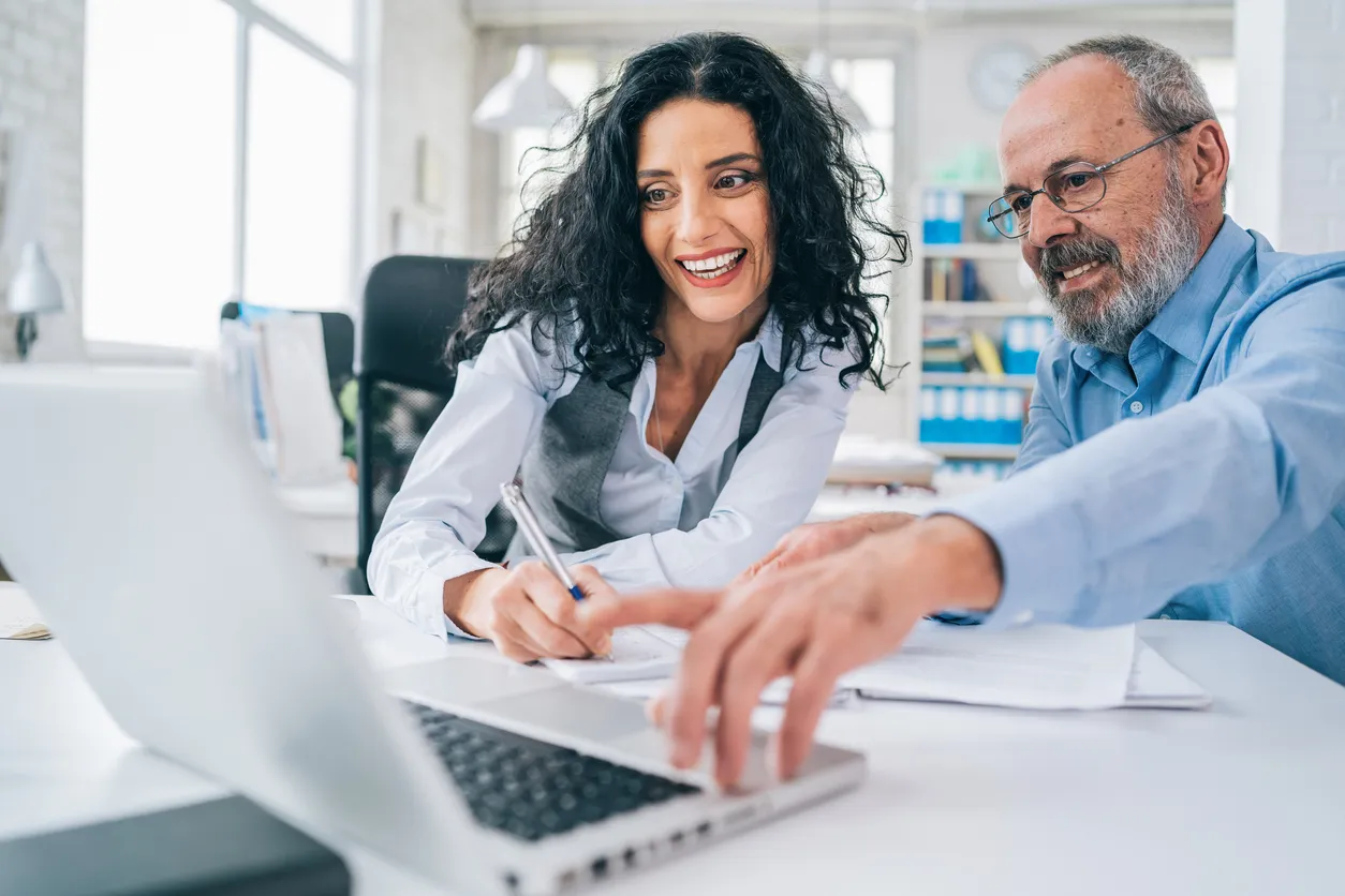 Avoid Tax Season Chaos: How a CPA Simplifies Home Service Taxes Manager and assistant discussing ideas at workplace