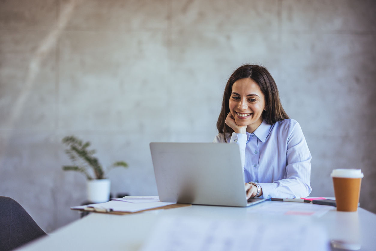 A smiling businesswoman in a modern office setting