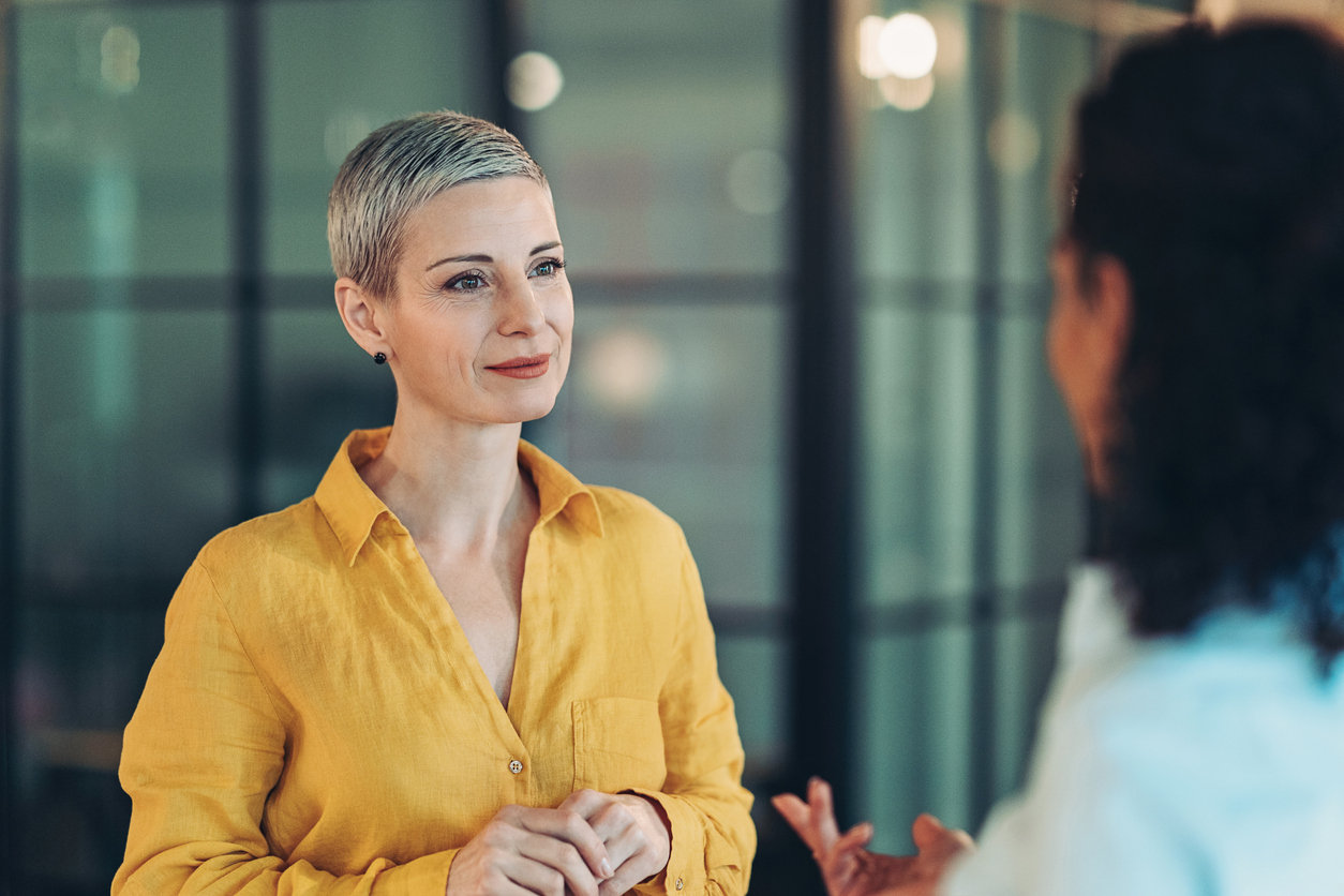 Two businesswomen talking in the office