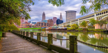 Cleveland, Ohio, USA downtown skyline on the Cuyahoga River at dusk.
