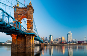 Cincinnati skyline and Roebling Suspension Bridge at dawn