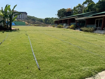 Aranyam’s Tent Camping — lawn and resort buildings