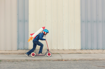 A little kid running to launch a rocket