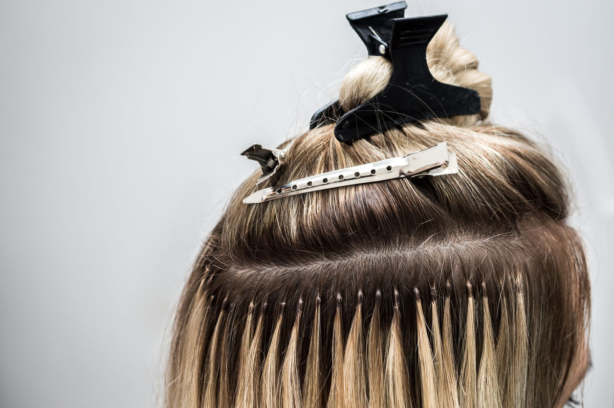 Transform your hair with Indian Hair Impex extensions. A woman with taped in hair
