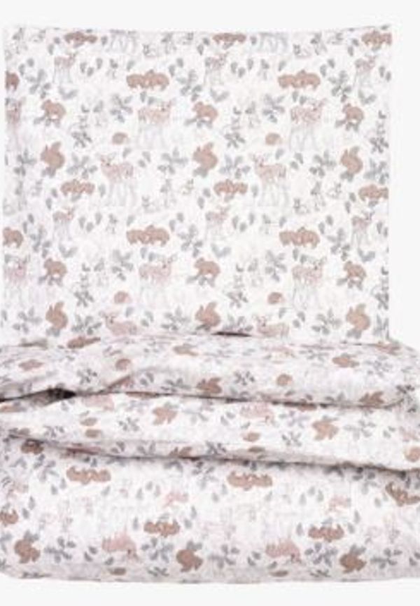 Ljusgrön Little Roomies-spjälsäng i modern modell.