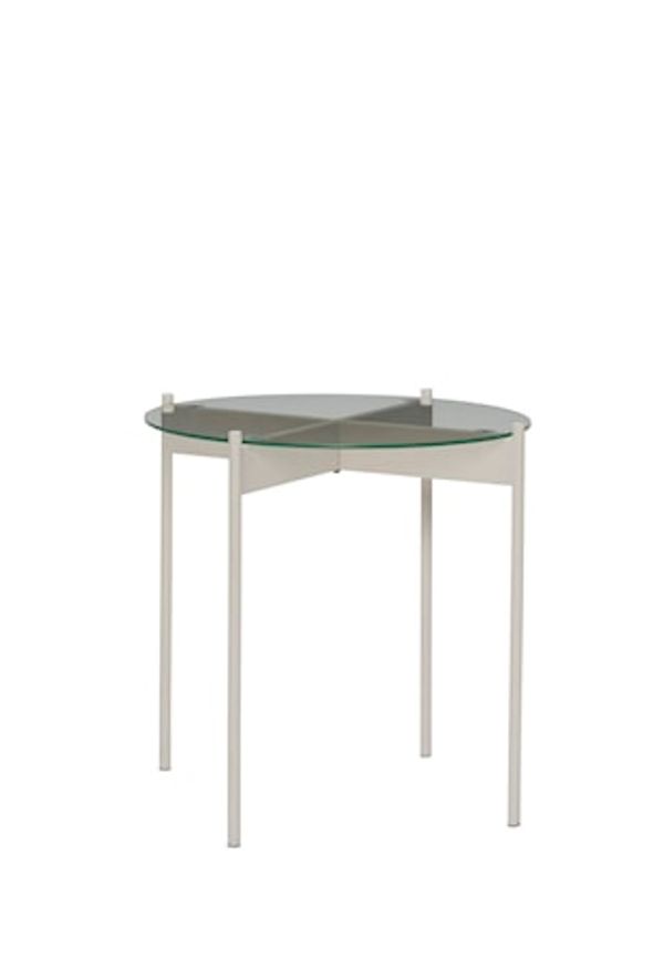 Exklusiv järnbord i beiget från Hübsch.