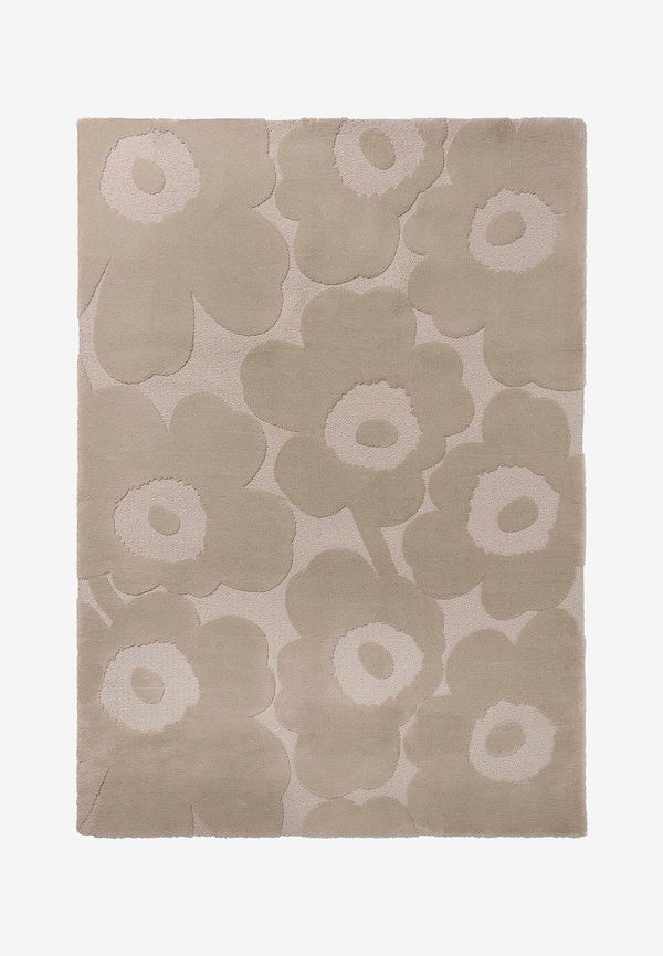 Stilren matta i beige färg gjord i ull.