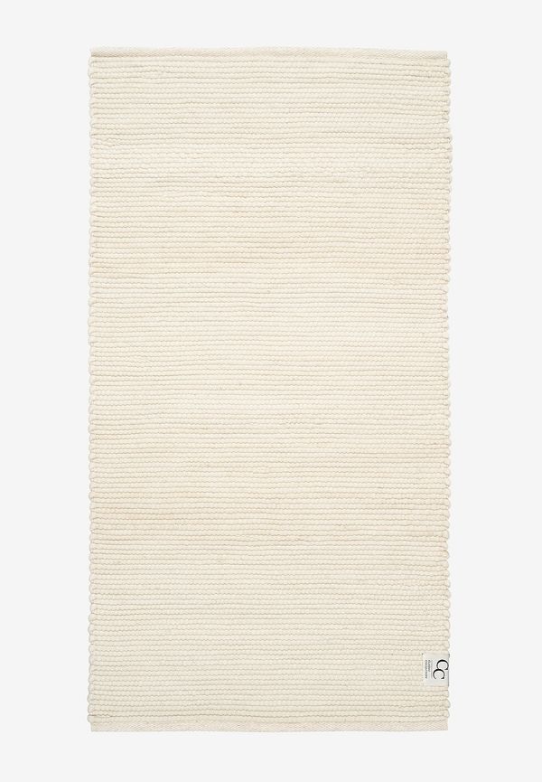 Fantastiskt snygg vit matta i ull från Classic Collection.