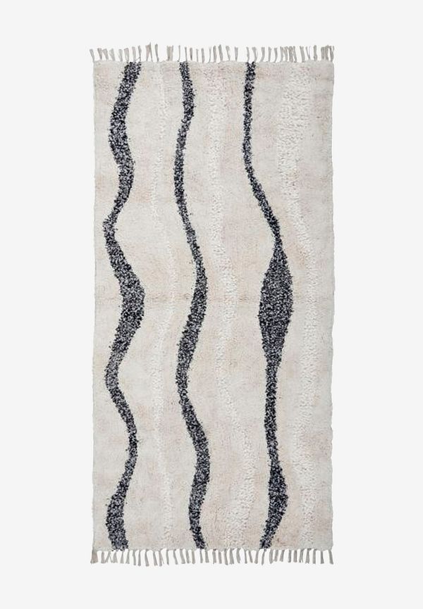 Otroligt fin beige matta i bomull från House Doctor.